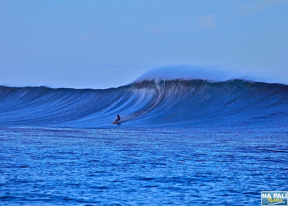 a man riding a wave on top of a body of water