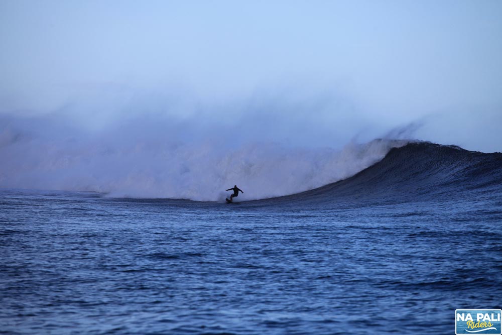 a man riding a wave on top of a body of water