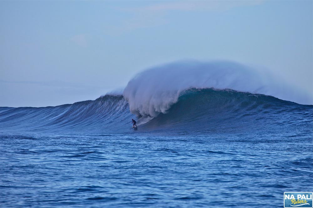 a man riding a wave in the ocean