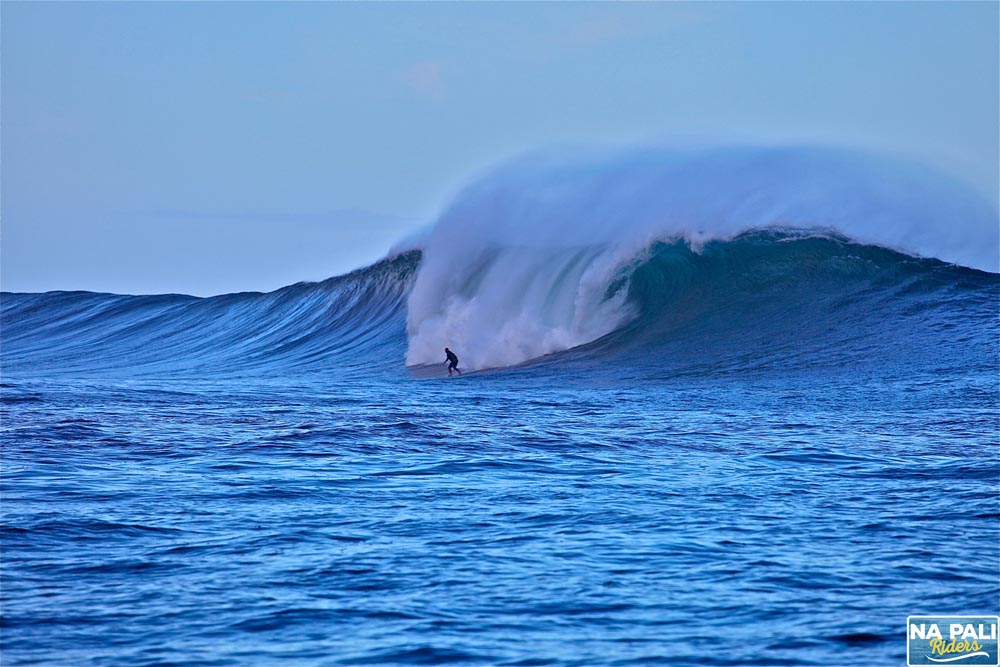 a man riding a wave on top of a body of water