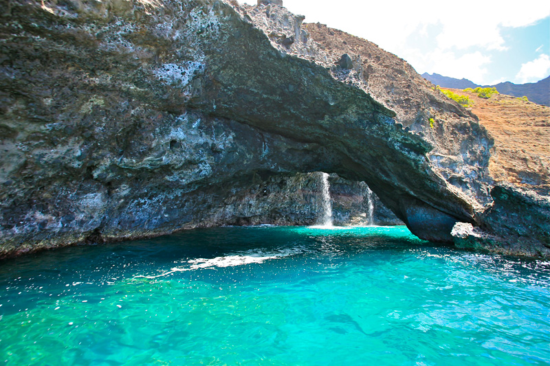 a large pool of water with a mountain in the background