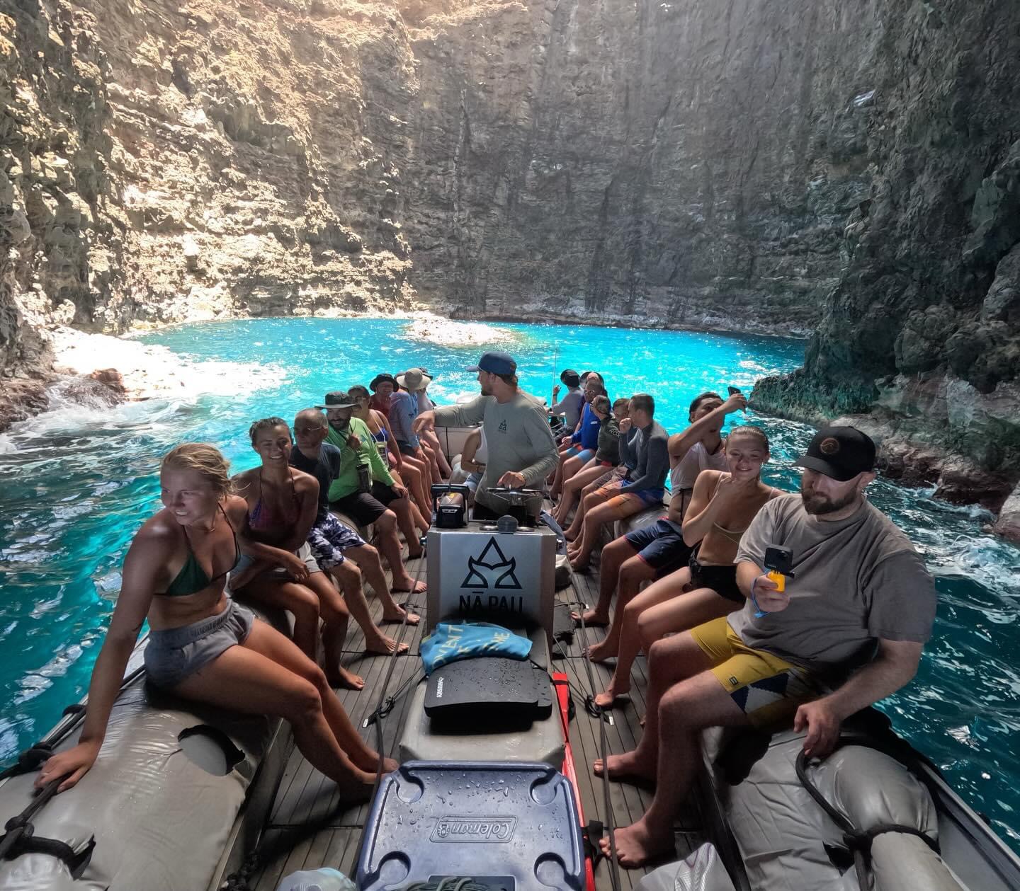 a group of people sitting on top of a mountain