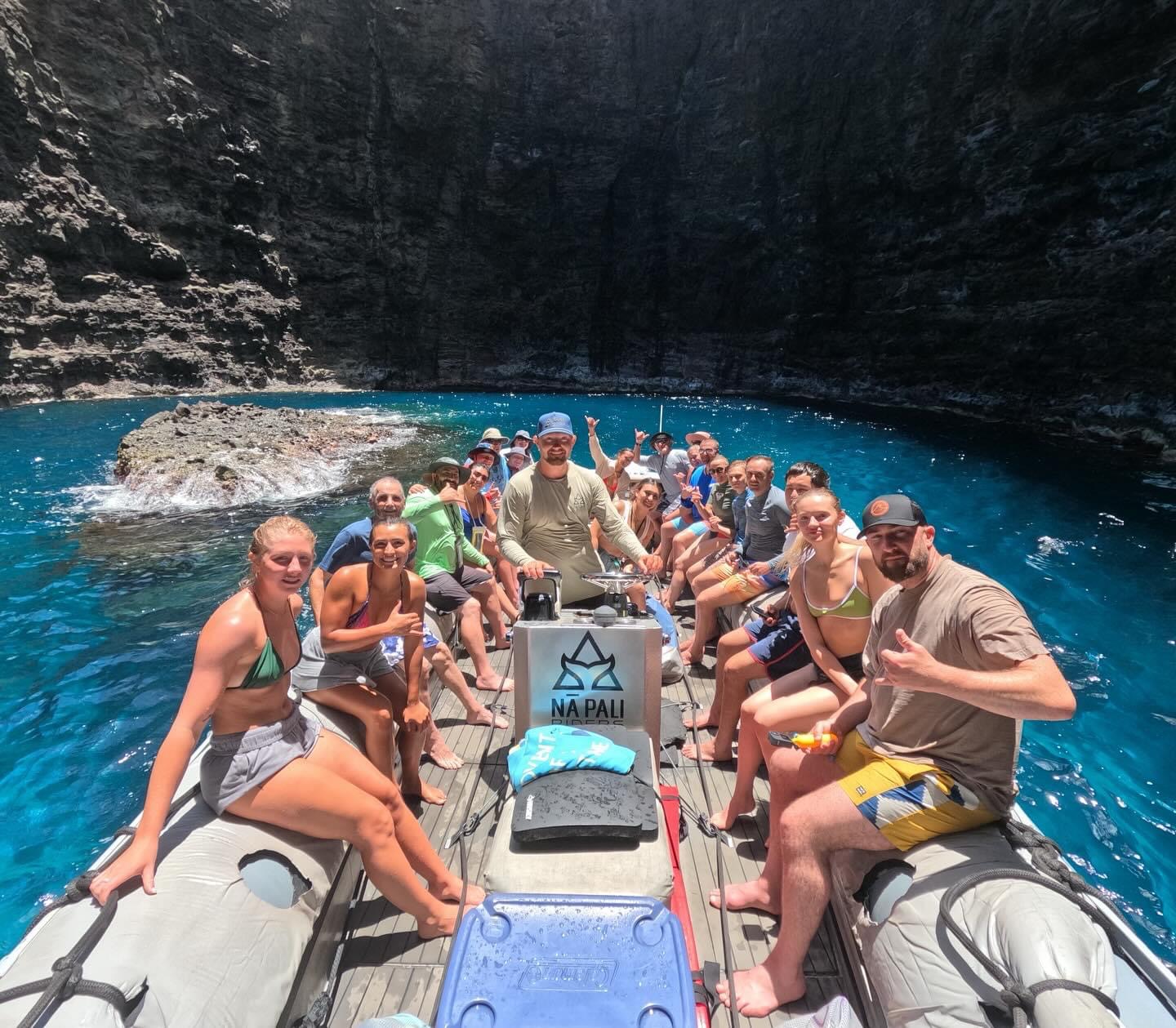 a group of people riding on the back of a boat